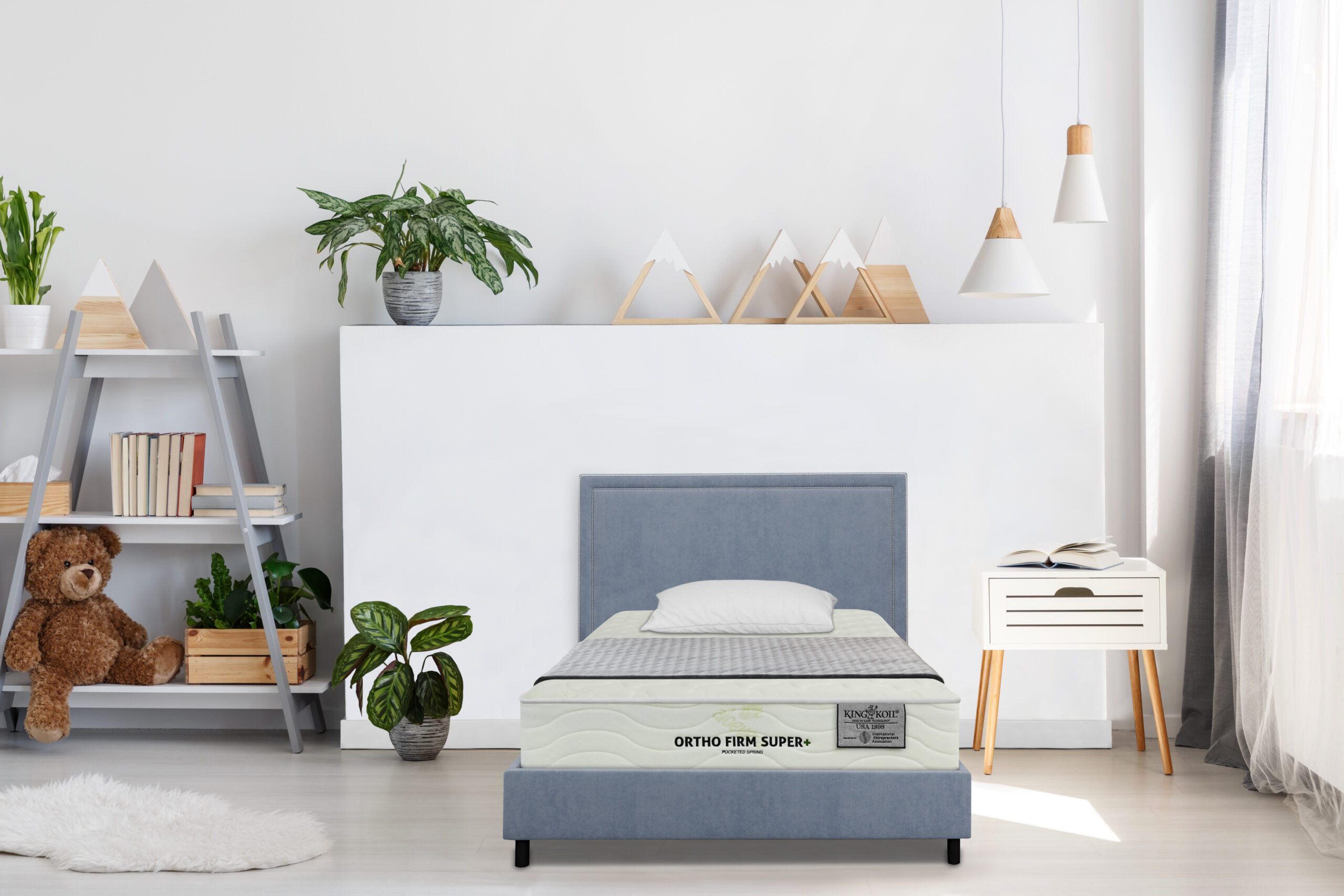 Gray,Bedding,On,A,Single,Bed,With,Metal,Frame,And