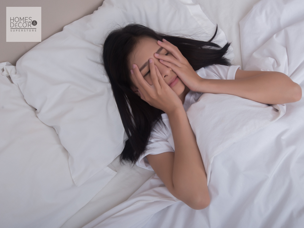 woman suffering from insomnia, in bed